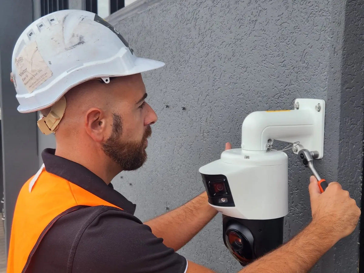 Crown Security technician mounting a commercial CCTV camera