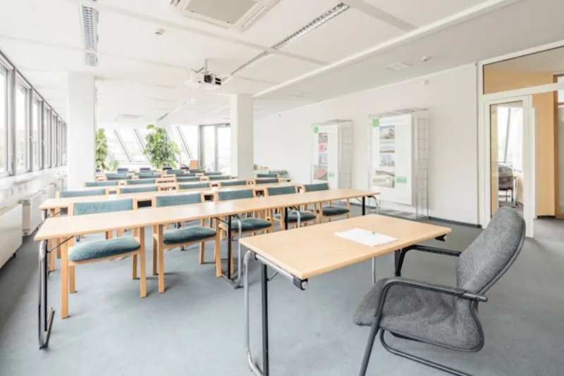 Education classroom interior with wooden desks and chairs