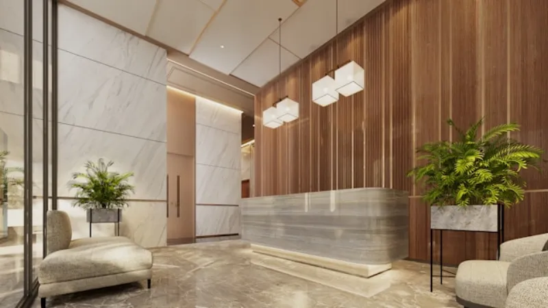 Modern strata building lobby with marble reception desk and plants