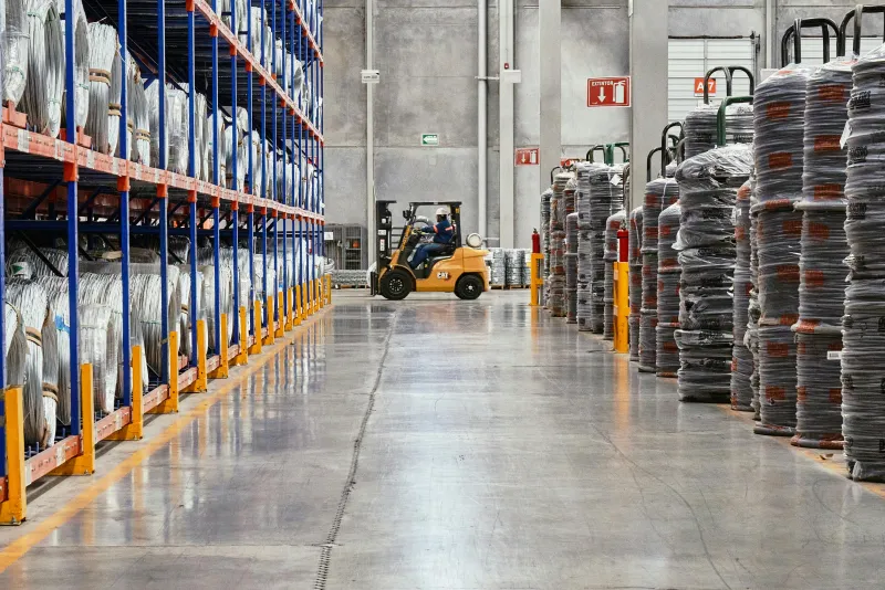 Industrial warehouse interior with forklift and shelving